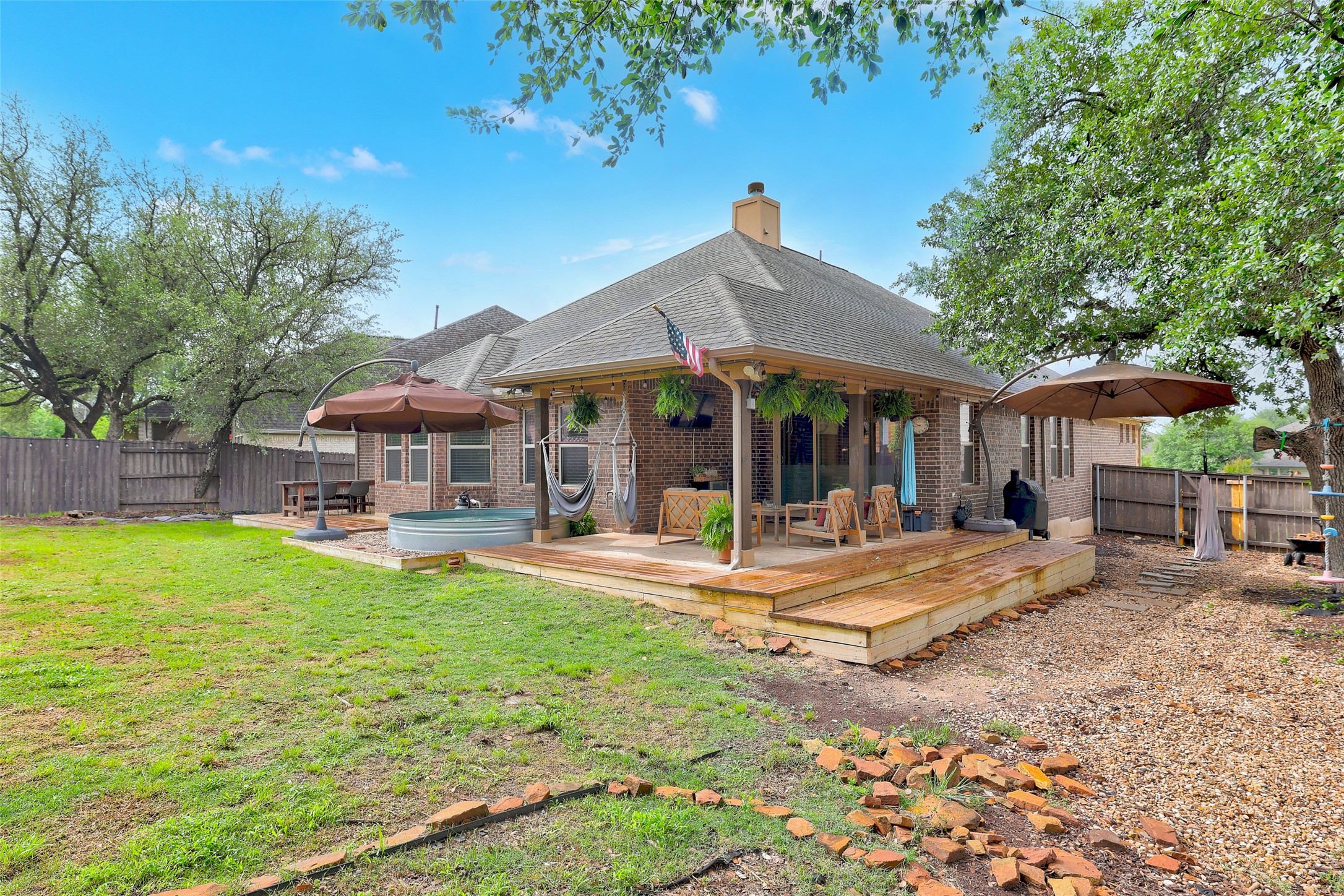 117 Rock Dock Road Georgetown, TX 78633 - Photo 35 of 38 a view of a house with backyard porch and sitting area
