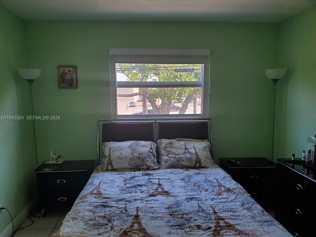 3901 Southwest 78th Court, Unit 221 Miami, FL 33155 - Photo 10 of 13 a bedroom with a bed and a window