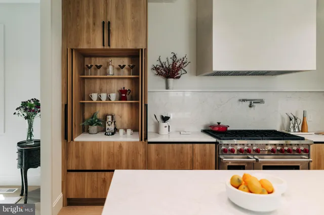 a kitchen with a refrigerator and a stove