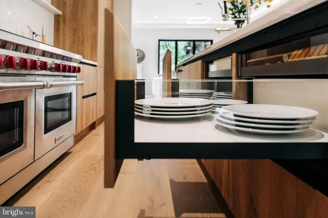 a view of living room with furniture and a fireplace
