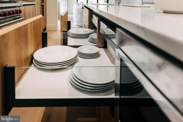a bathroom with a toilet a sink and a window