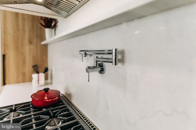 a kitchen with a refrigerator and a sink