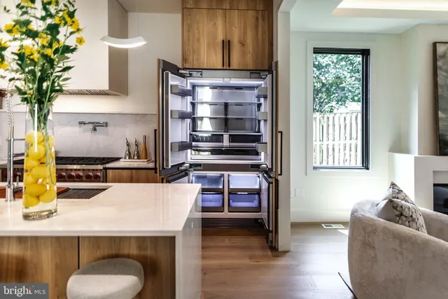 a kitchen with a refrigerator and a stove