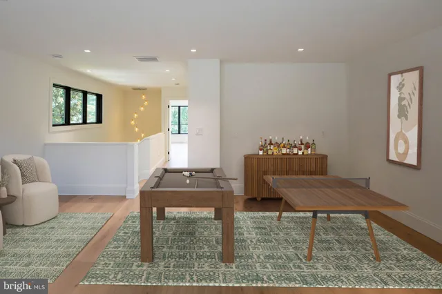 a view of a work space with wooden floor and a potted plant