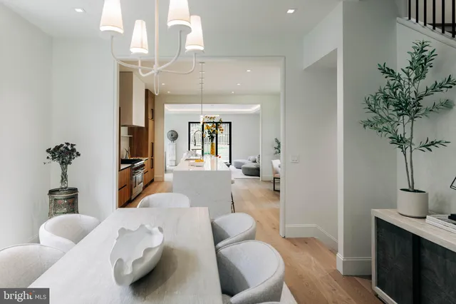 a bedroom with furniture and a chandelier