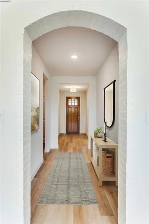 a hallway with sliding door and entryway