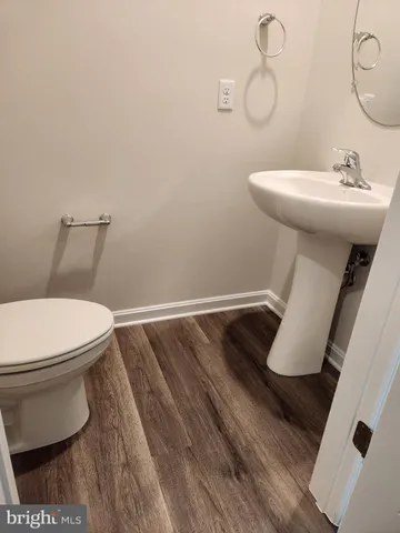 a bathroom with a toilet and a sink