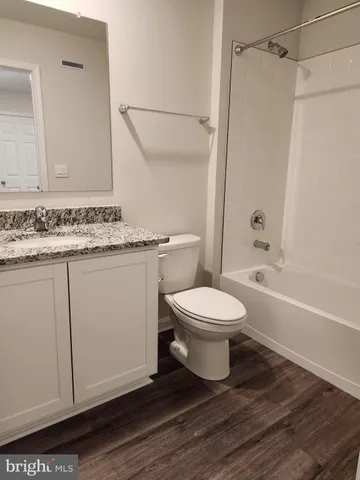 a bathroom with a toilet a sink and a shower