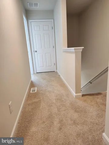 a view of a room with an empty space