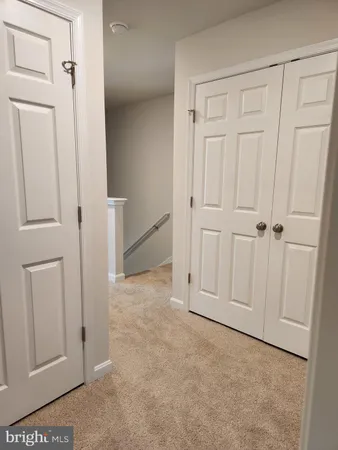 an empty room with cabinet door