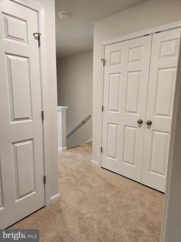 an empty room with cabinet door