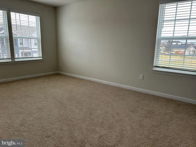 a view of livingroom with hardwood floor and window