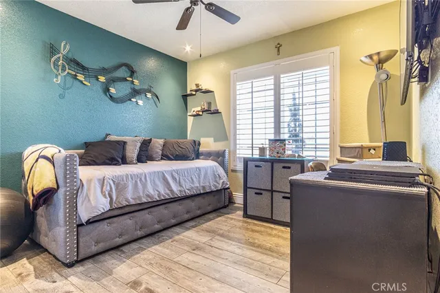 a bedroom with a bed and window