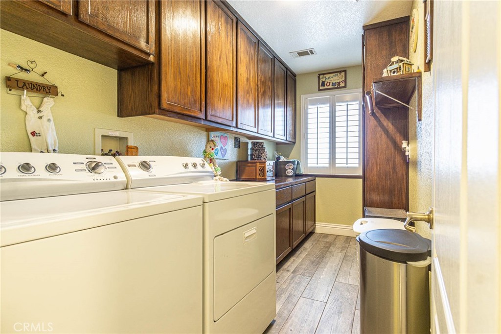 9735 Elsinore Road Oak Hills, CA 92344 - Photo 36 of 64 a kitchen with a sink appliances and cabinets