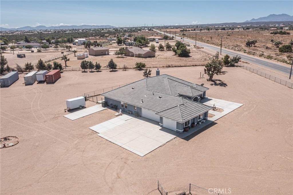 9735 Elsinore Road Oak Hills, CA 92344 - Photo 42 of 64 an aerial view of a house with beach