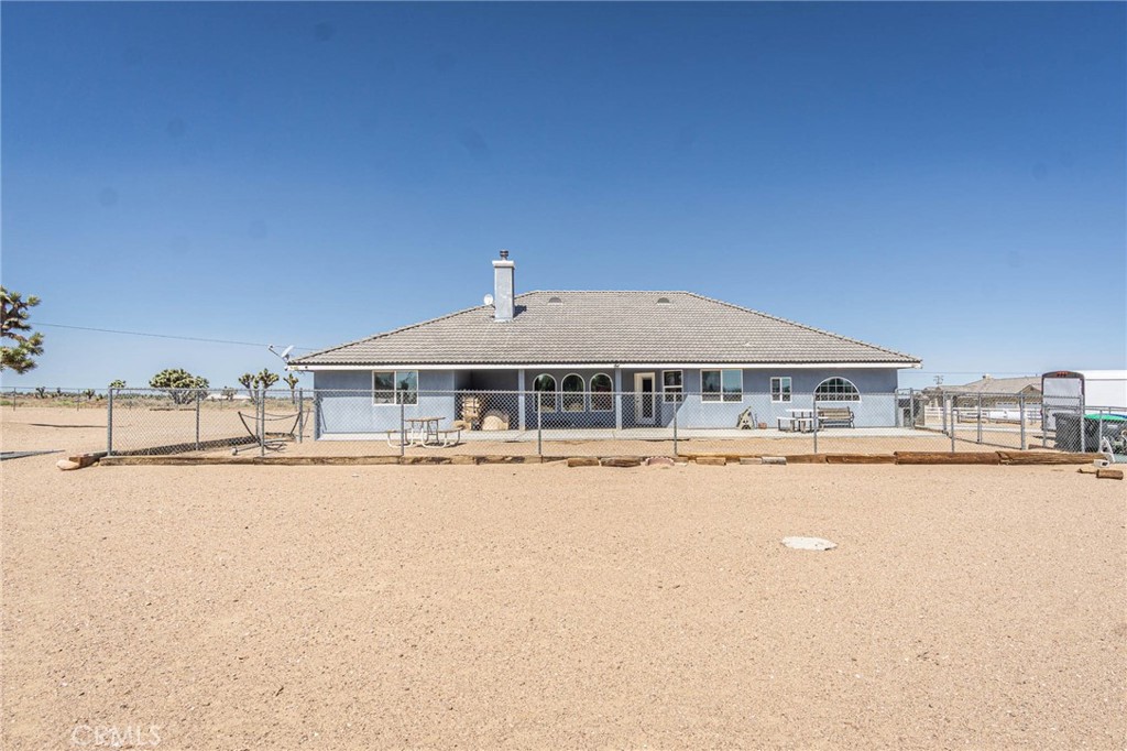 9735 Elsinore Road Oak Hills, CA 92344 - Photo 43 of 64 a house with a outdoor space