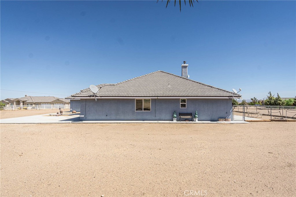 9735 Elsinore Road Oak Hills, CA 92344 - Photo 46 of 64 a front view of a house with yard