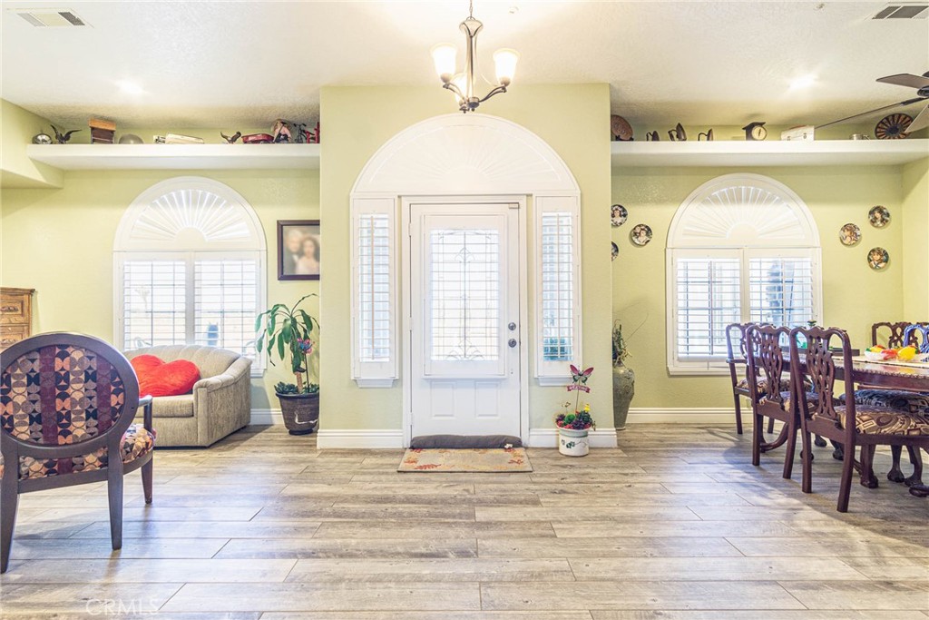 9735 Elsinore Road Oak Hills, CA 92344 - Photo 5 of 64 a view of a livingroom with furniture and a window