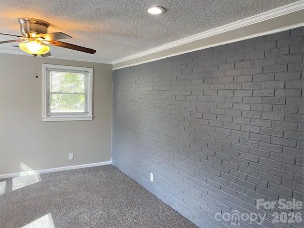 a bathroom with a light fixture and a shower