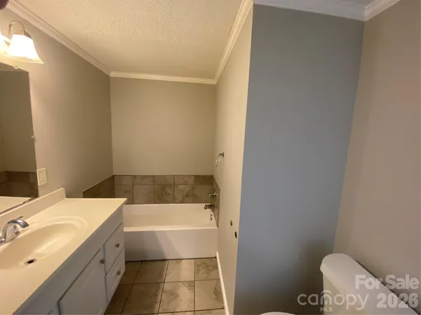 a bathroom with a bathtub and sink