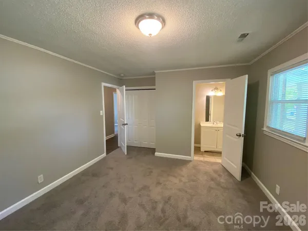 a view of an empty room and a windows
