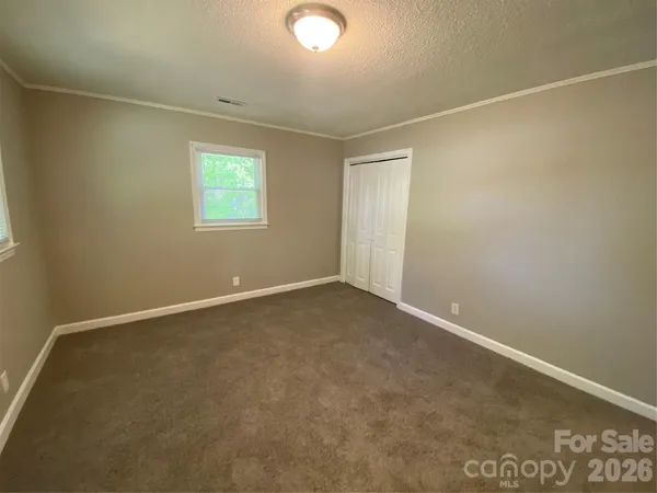 an empty room with a empty space and a window