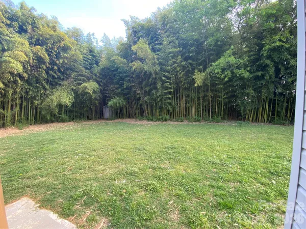 a backyard of a house with lots of green space