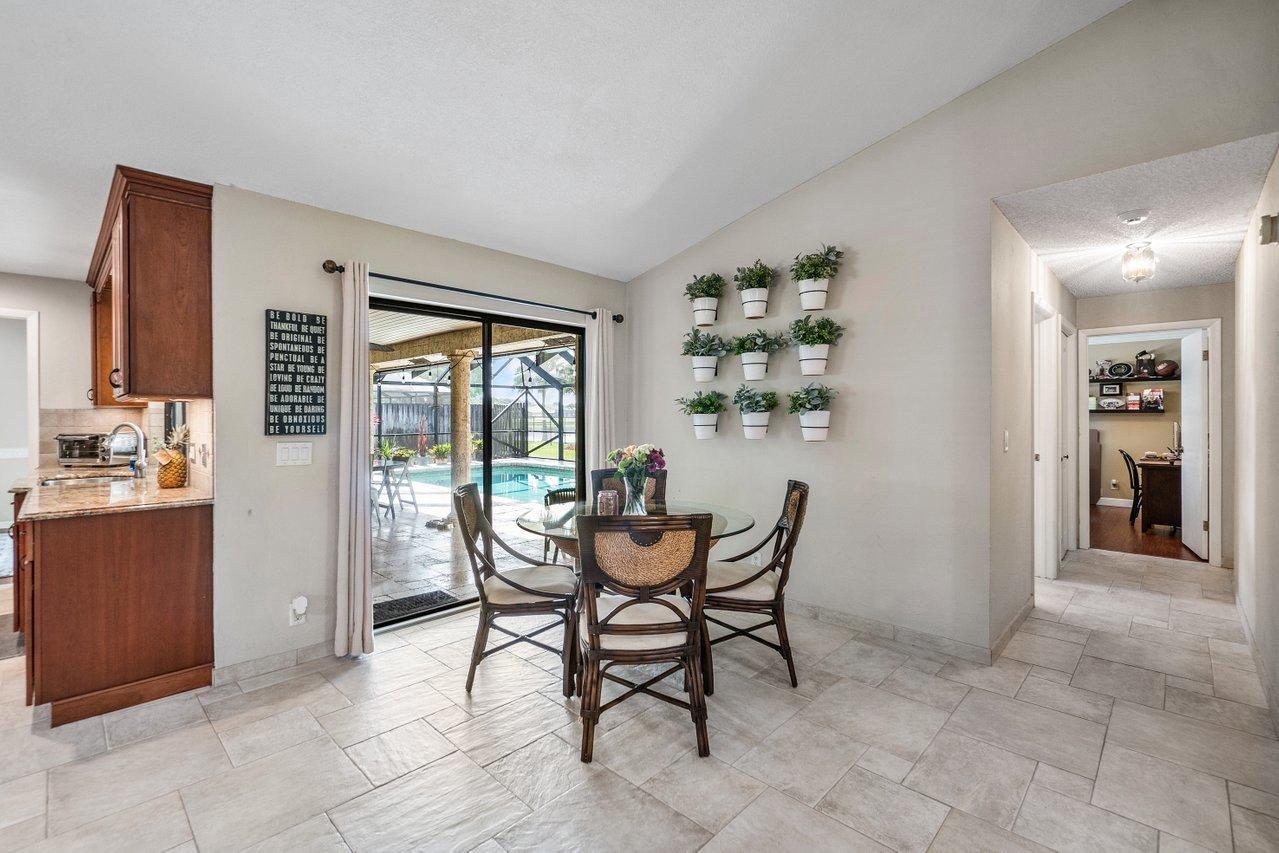 22250 Martella Avenue Boca Raton, FL 33433 - Photo 11 of 45 a dining room with furniture and window