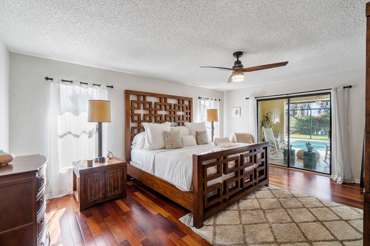 22250 Martella Avenue Boca Raton, FL 33433 - Photo 15 of 45 a bed room with a bed and a couch