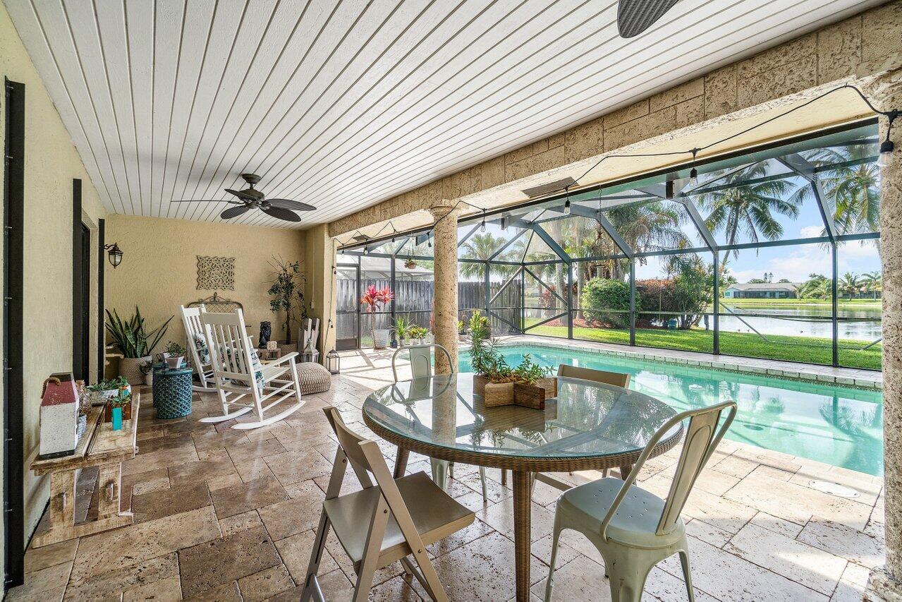 22250 Martella Avenue Boca Raton, FL 33433 - Photo 27 of 45 a outdoor dining space with a garden view