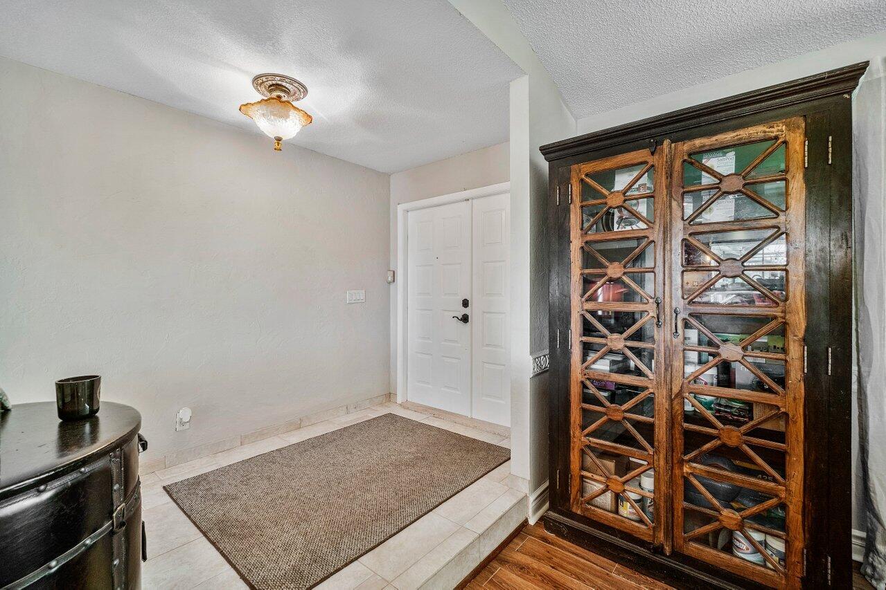 22250 Martella Avenue Boca Raton, FL 33433 - Photo 3 of 45 a view of empty room with wooden floor