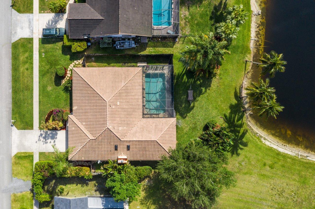 22250 Martella Avenue Boca Raton, FL 33433 - Photo 36 of 45 an aerial view of a house with yard swimming pool and outdoor seating