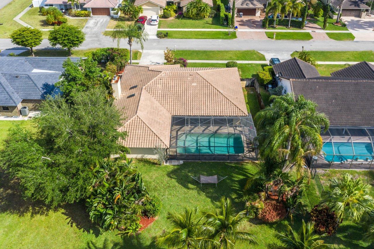 22250 Martella Avenue Boca Raton, FL 33433 - Photo 37 of 45 an aerial view of a house with a yard basket ball court and outdoor seating