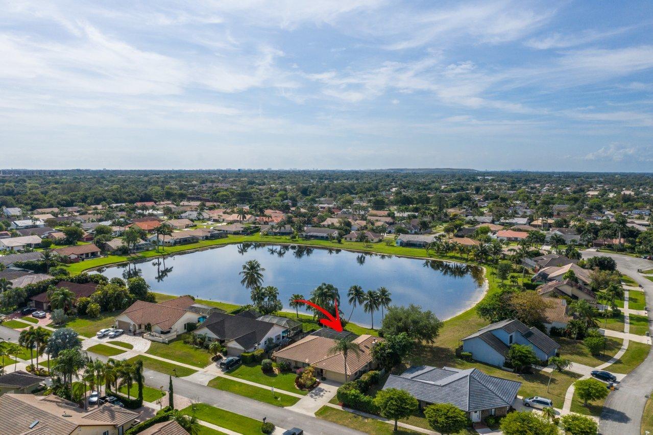 22250 Martella Avenue Boca Raton, FL 33433 - Photo 40 of 45 an aerial view of residential houses with outdoor space and lake view in back