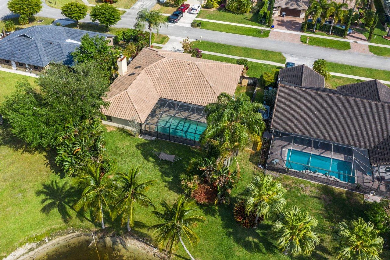 22250 Martella Avenue Boca Raton, FL 33433 - Photo 42 of 45 an aerial view of a house with a yard basket ball court and outdoor seating