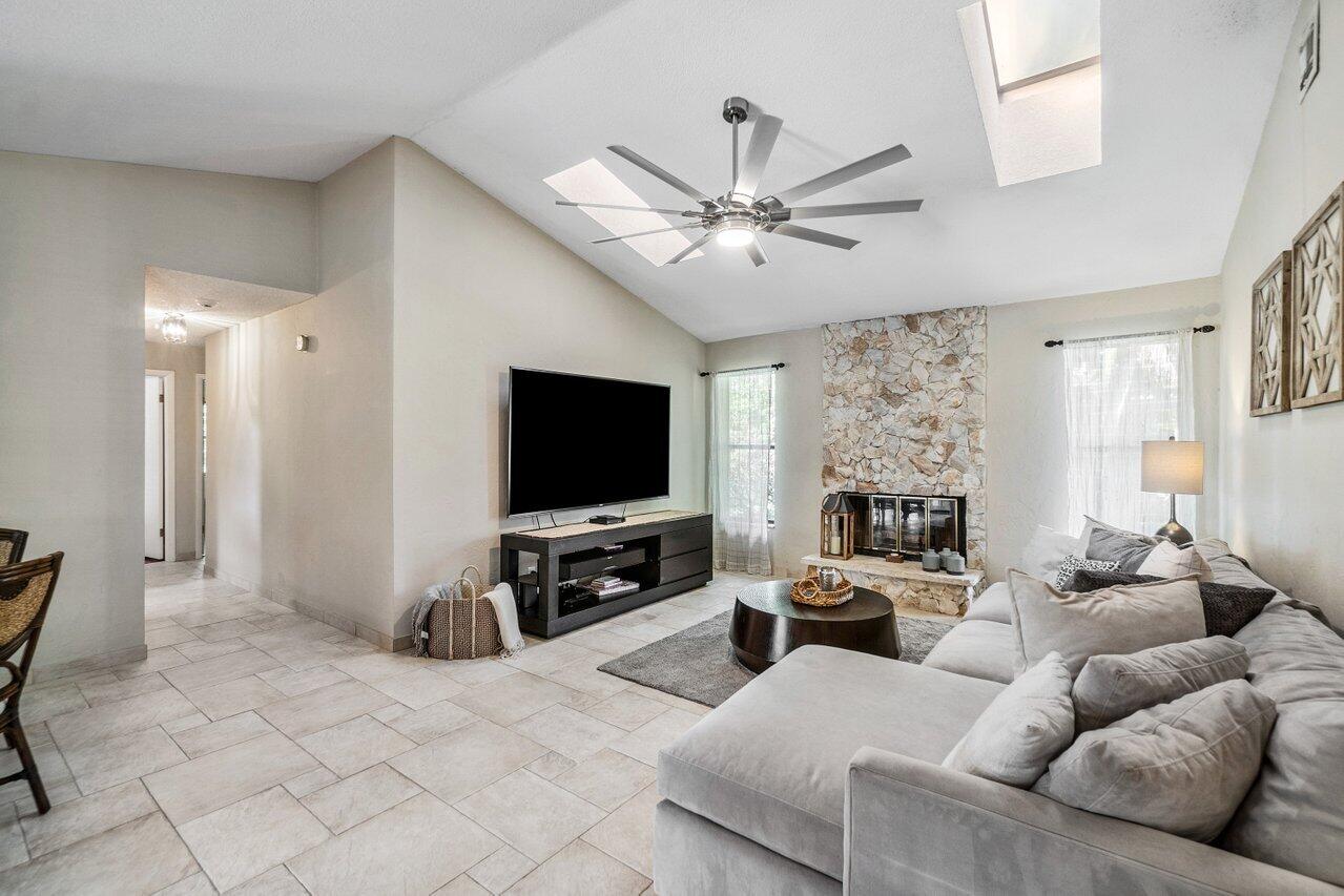 22250 Martella Avenue Boca Raton, FL 33433 - Photo 5 of 45 a living room with furniture and a flat screen tv