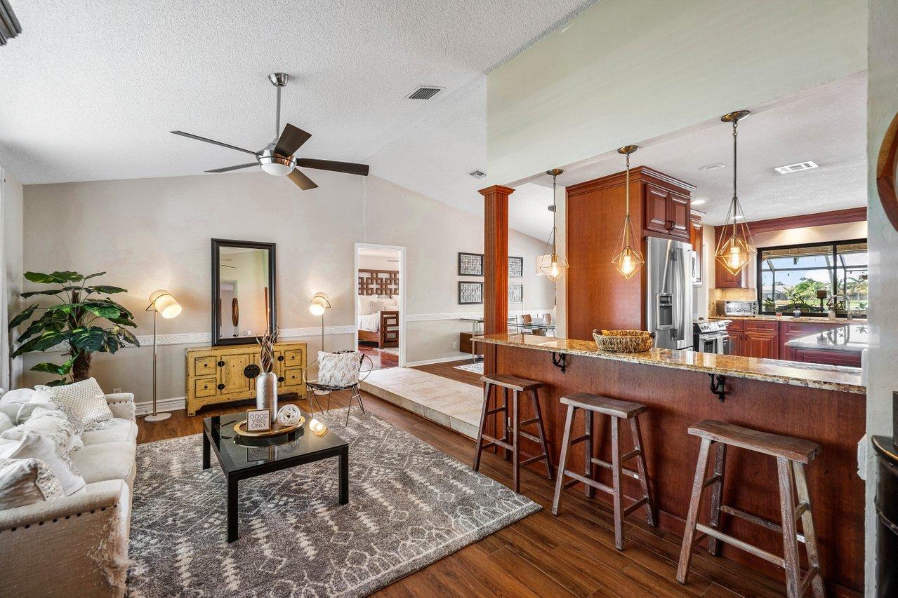 22250 Martella Avenue Boca Raton, FL 33433 - Photo 9 of 45 a large kitchen with a table and chairs