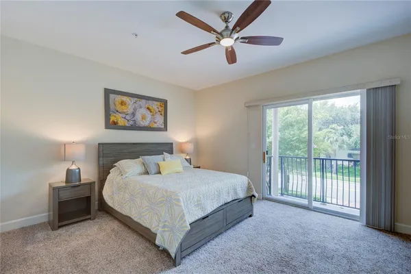 a bedroom with a bed and wall painting