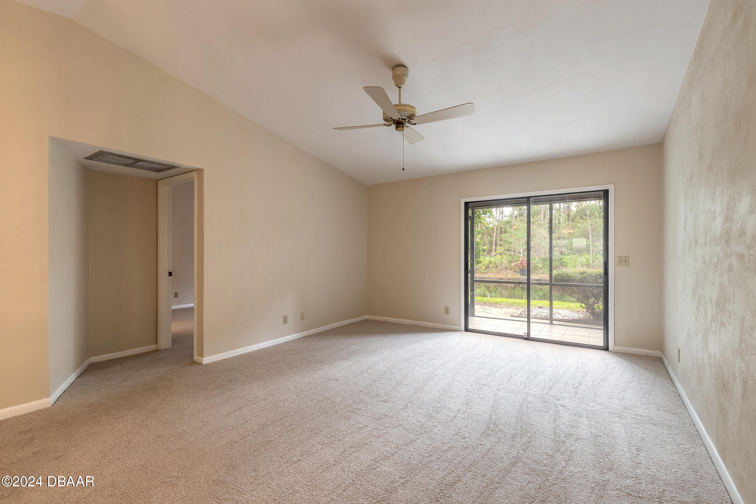 251 Orange Grove Drive, Unit 2 Ormond Beach, FL 32174 - Photo 14 of 32 a view of an empty room with a window