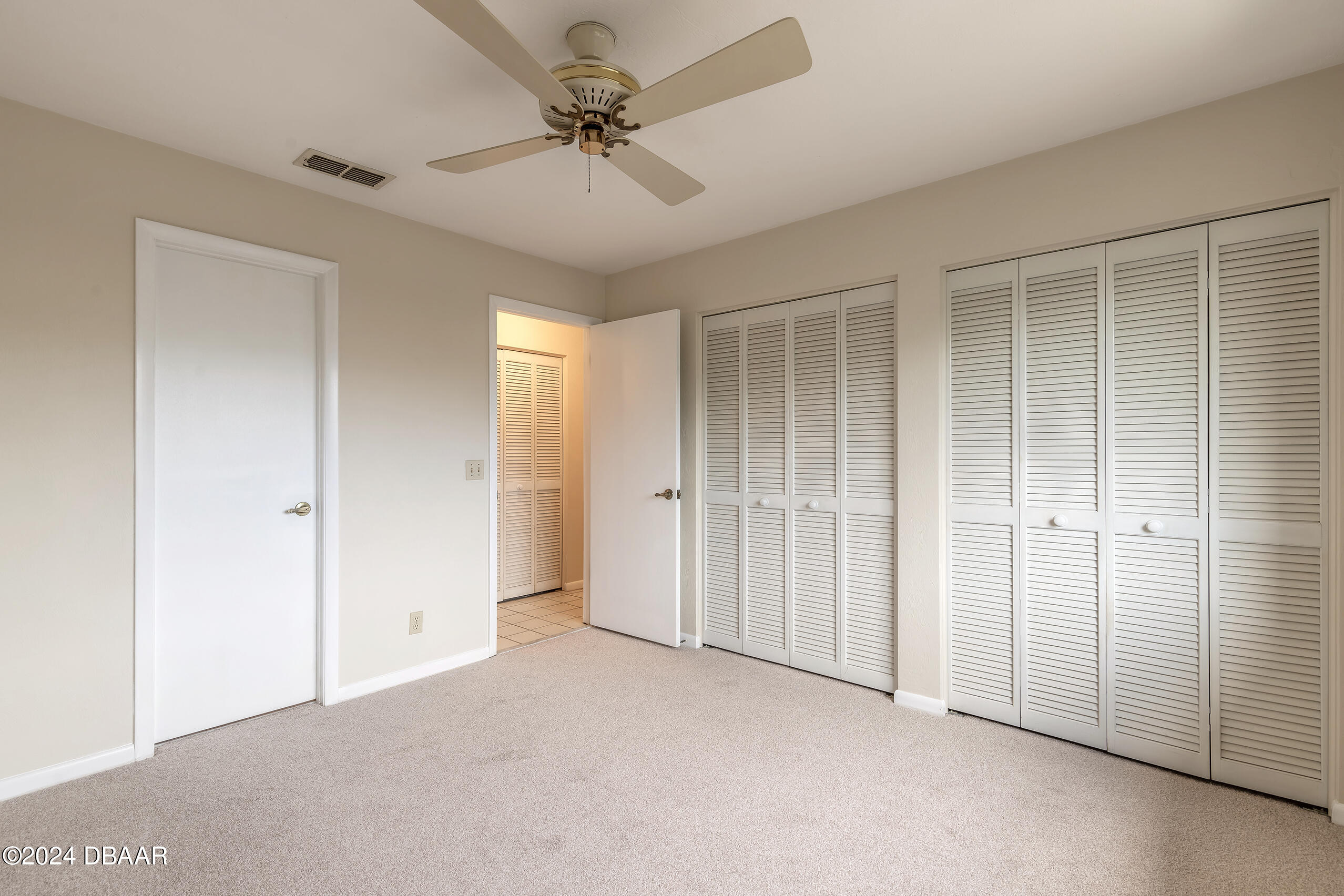 251 Orange Grove Drive, Unit 2 Ormond Beach, FL 32174 - Photo 19 of 32 a view of a livingroom with a chandelier fan