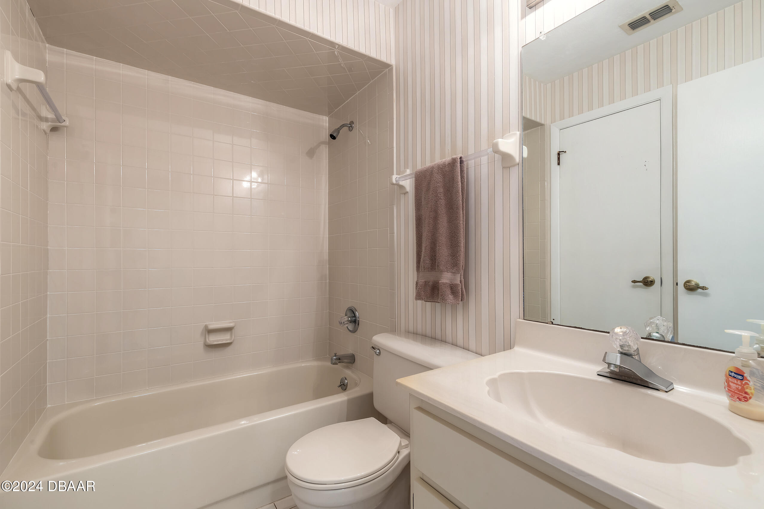251 Orange Grove Drive, Unit 2 Ormond Beach, FL 32174 - Photo 20 of 32 a bathroom with a sink toilet and shower