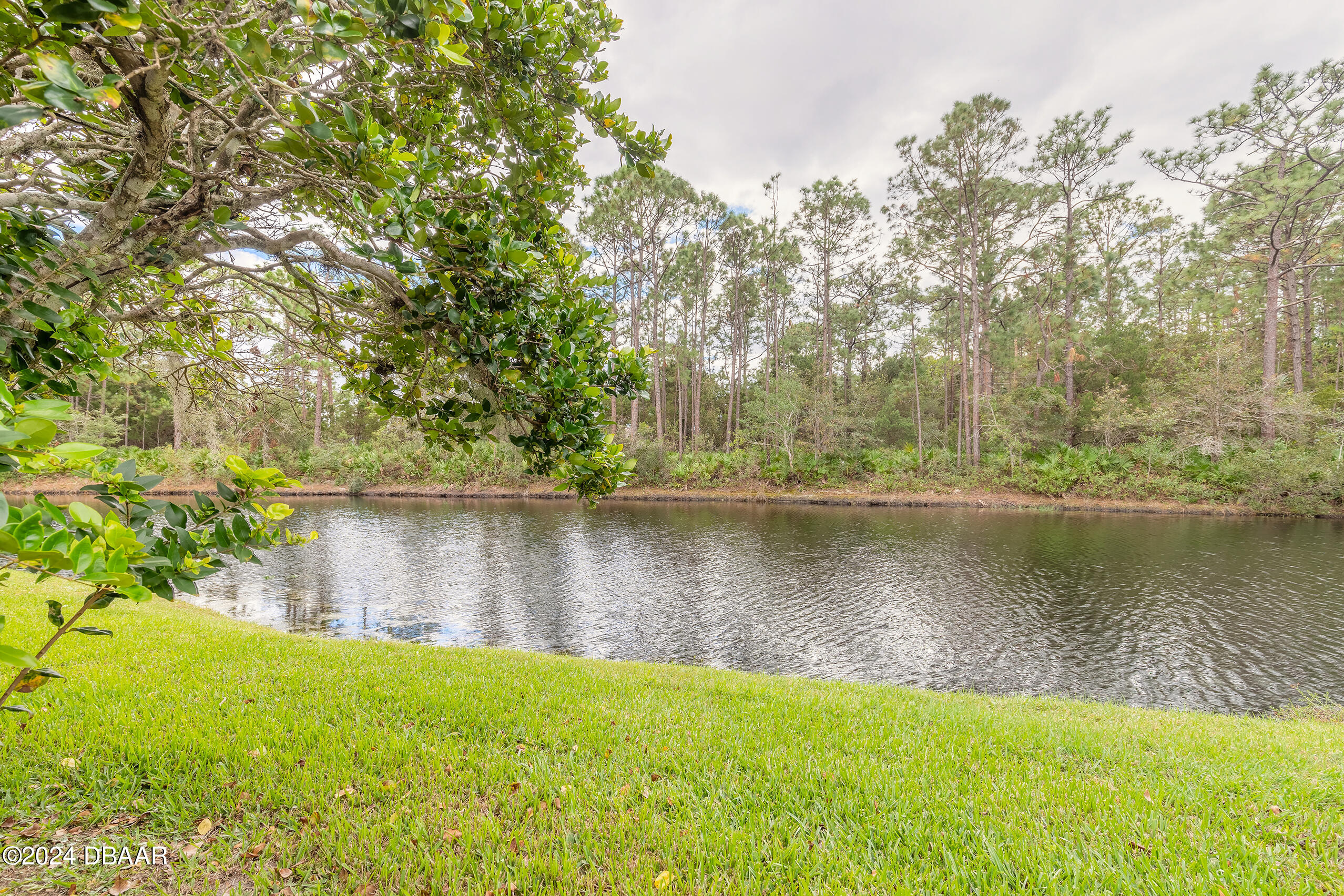 251 Orange Grove Drive, Unit 2 Ormond Beach, FL 32174 - Photo 25 of 32 a view of a lake
