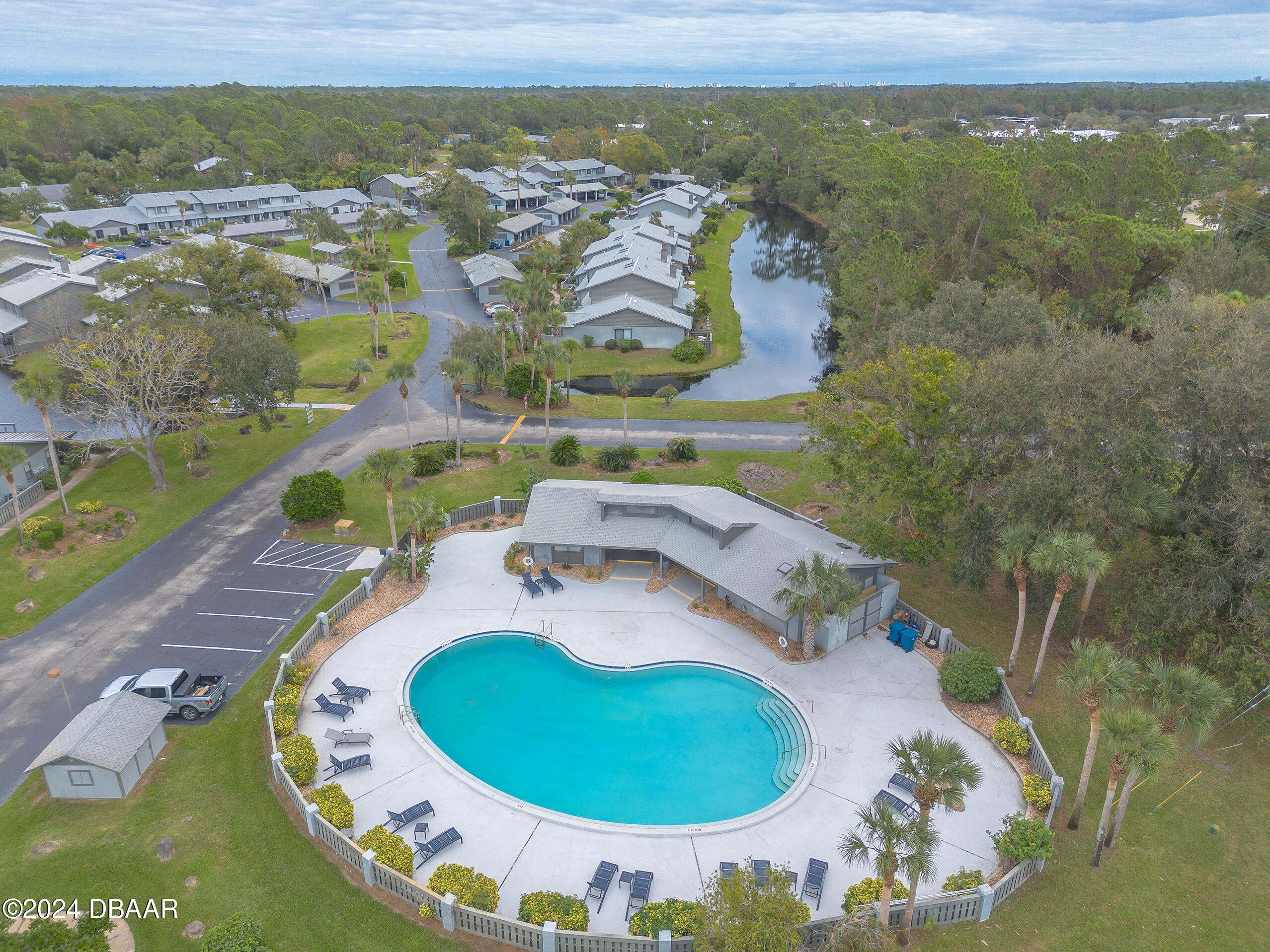 251 Orange Grove Drive, Unit 2 Ormond Beach, FL 32174 - Photo 31 of 32 an aerial view of a house with a swimming pool