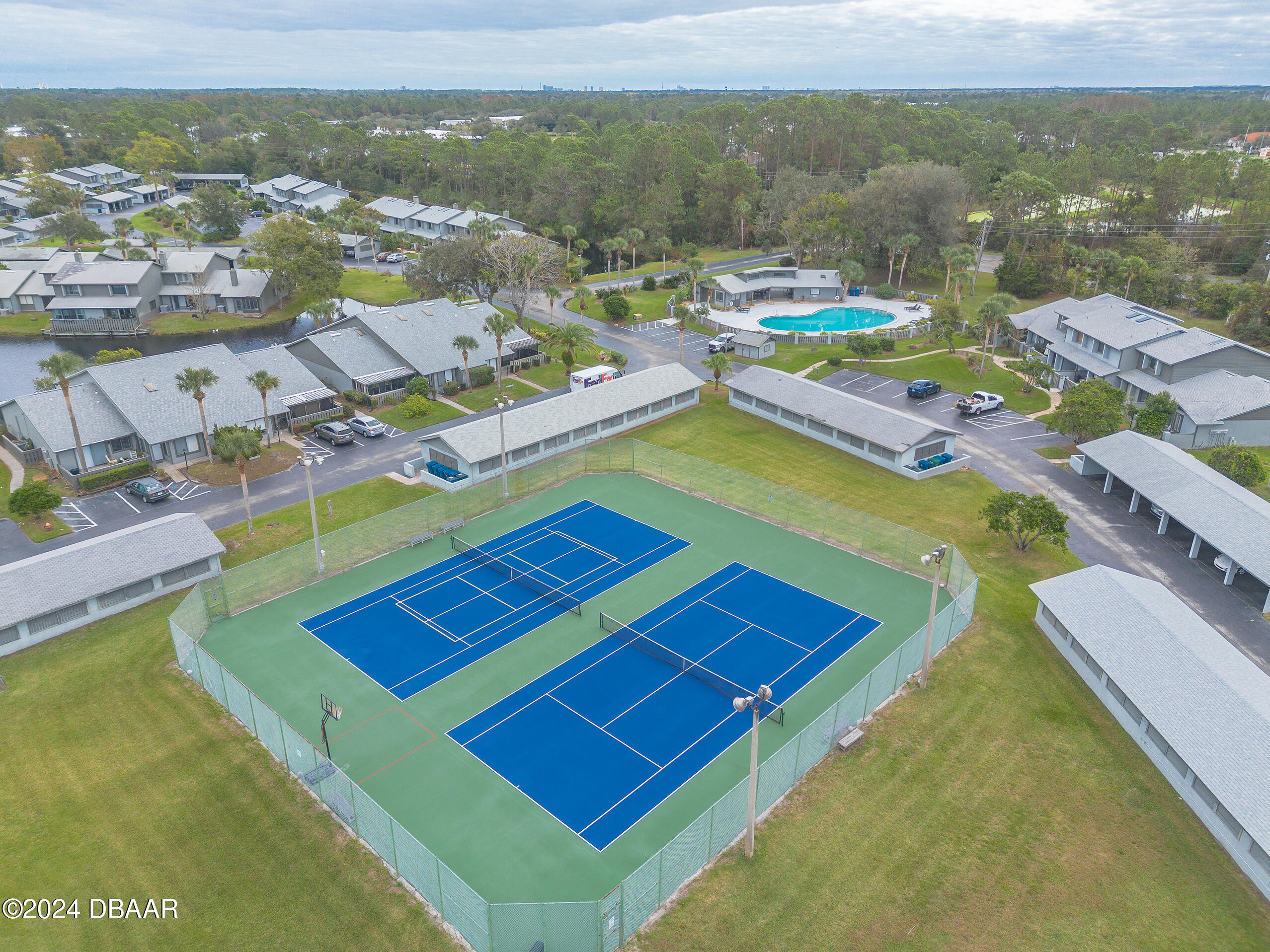 251 Orange Grove Drive, Unit 2 Ormond Beach, FL 32174 - Photo 32 of 32 a view of a pool patio and mountain view