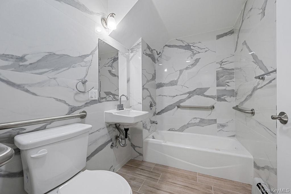 106-05 49th Avenue Queens, NY 11368 - Photo 11 of 39 a bathroom with a sink toilet and shower