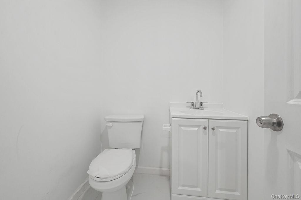 106-05 49th Avenue Queens, NY 11368 - Photo 15 of 39 a white toilet sitting next to a shower