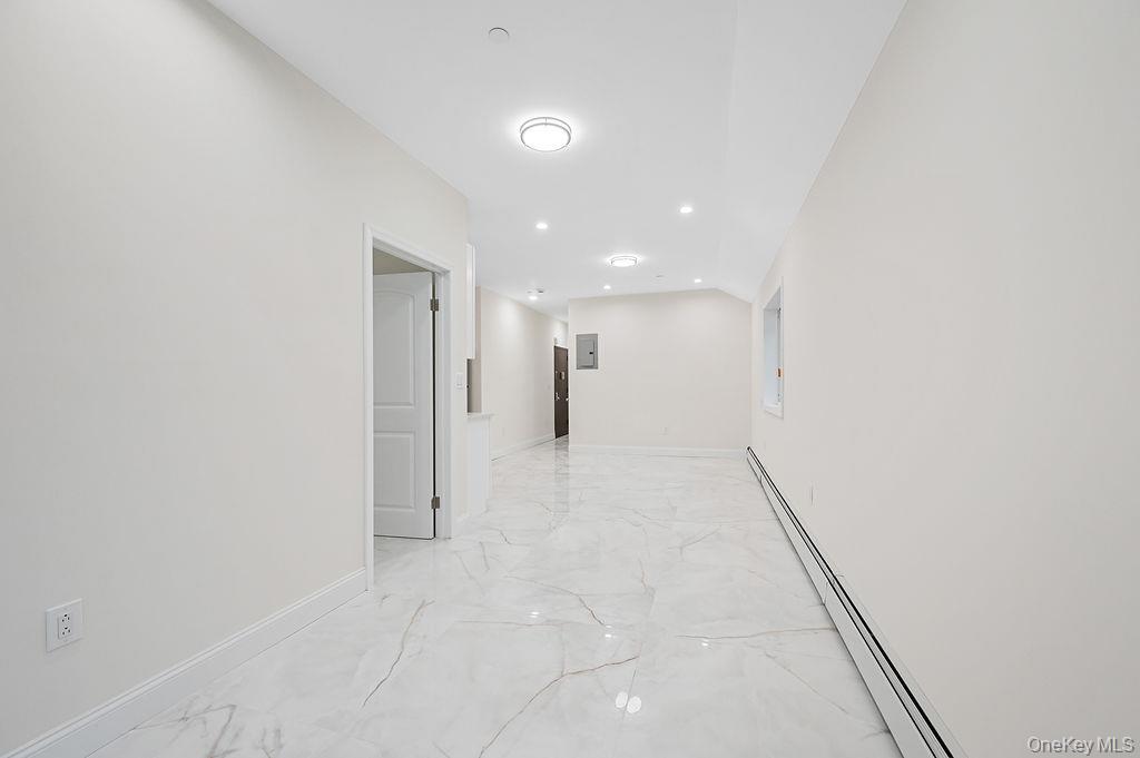 106-05 49th Avenue Queens, NY 11368 - Photo 26 of 39 a view of a big room with wooden floor and windows