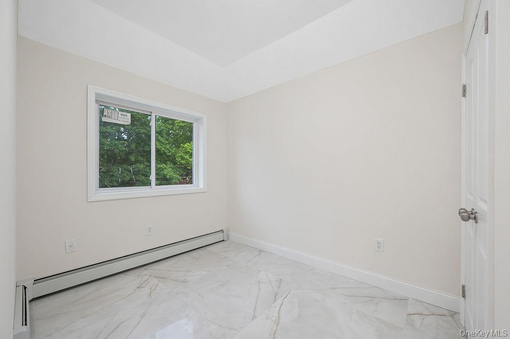 106-05 49th Avenue Queens, NY 11368 - Photo 27 of 39 an empty room with a window