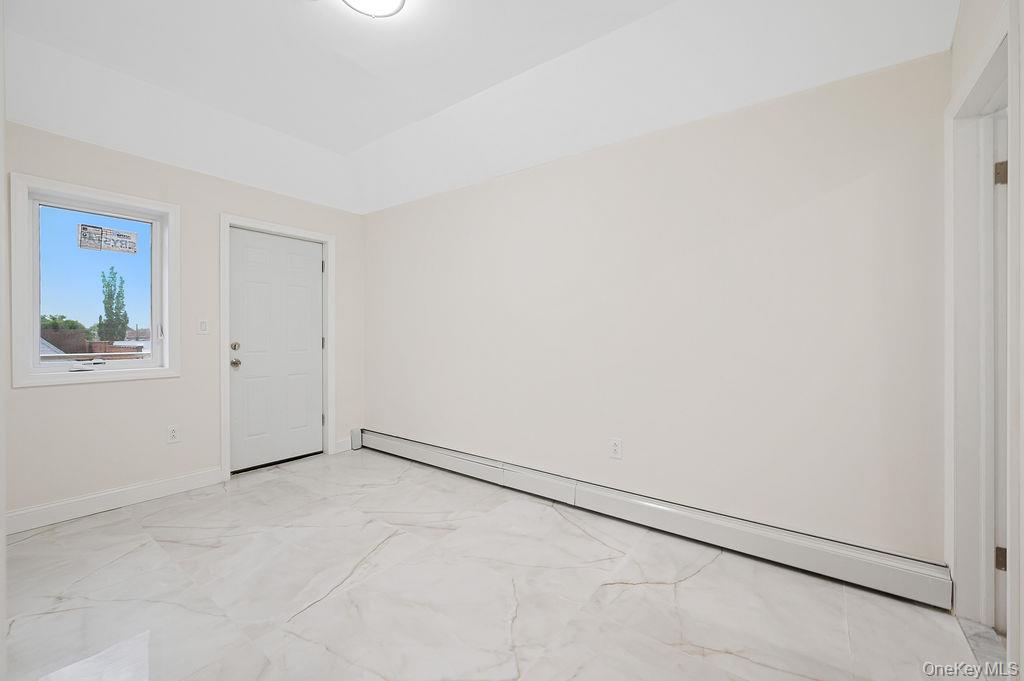106-05 49th Avenue Queens, NY 11368 - Photo 28 of 39 a view of an empty room