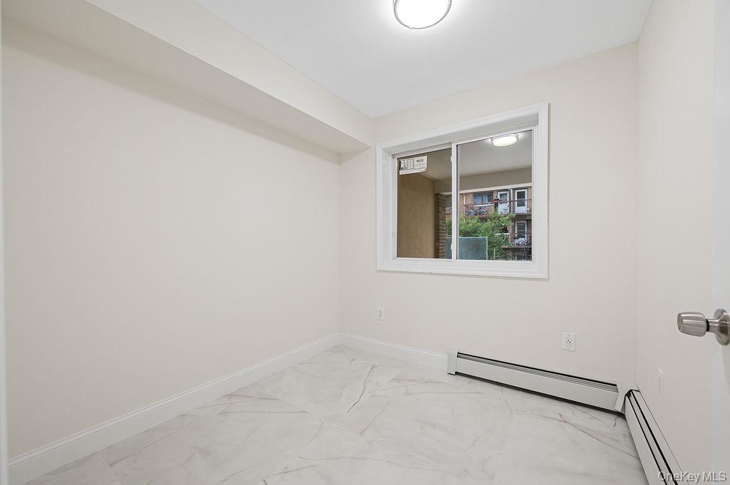 106-05 49th Avenue Queens, NY 11368 - Photo 30 of 39 an empty room with a window